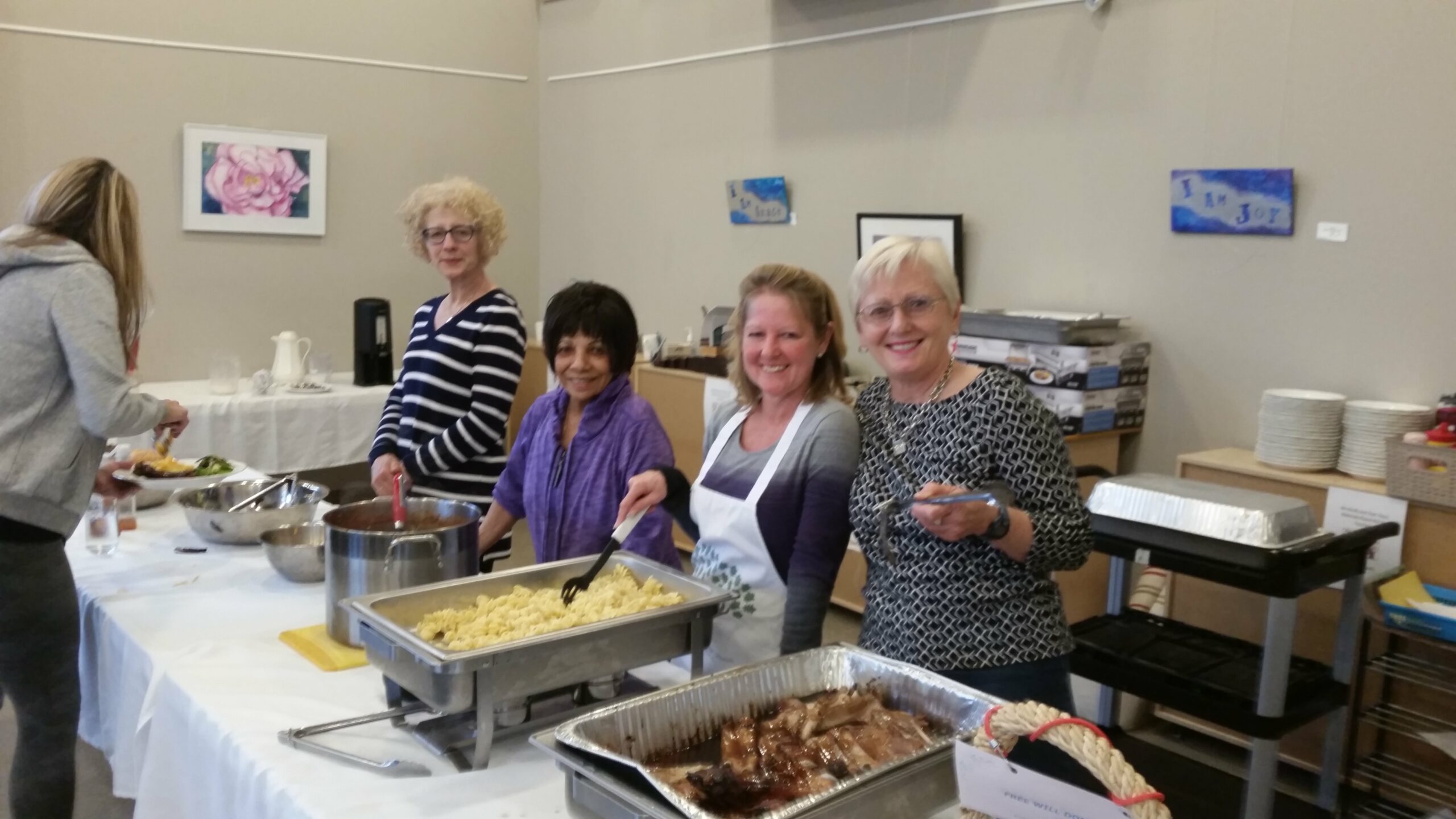 Volunteers serving a meal at St. Luke's Community Dinner
