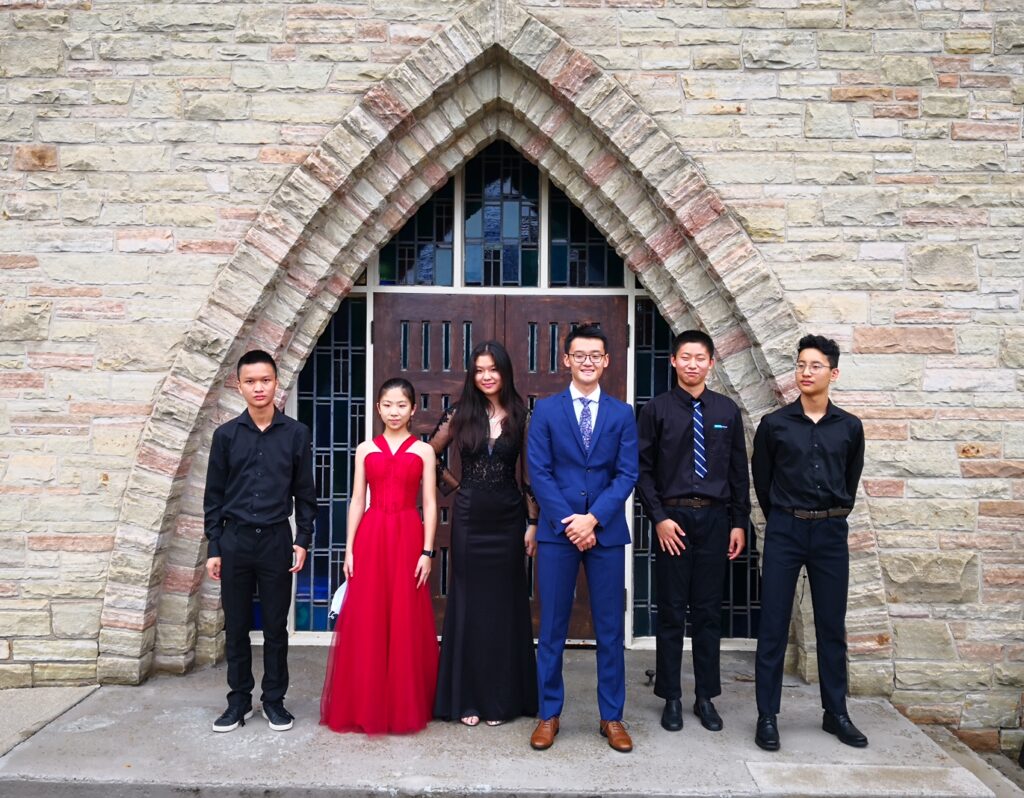 The Clearview Ensemble, posing in front of St. Cuthbert's Church door